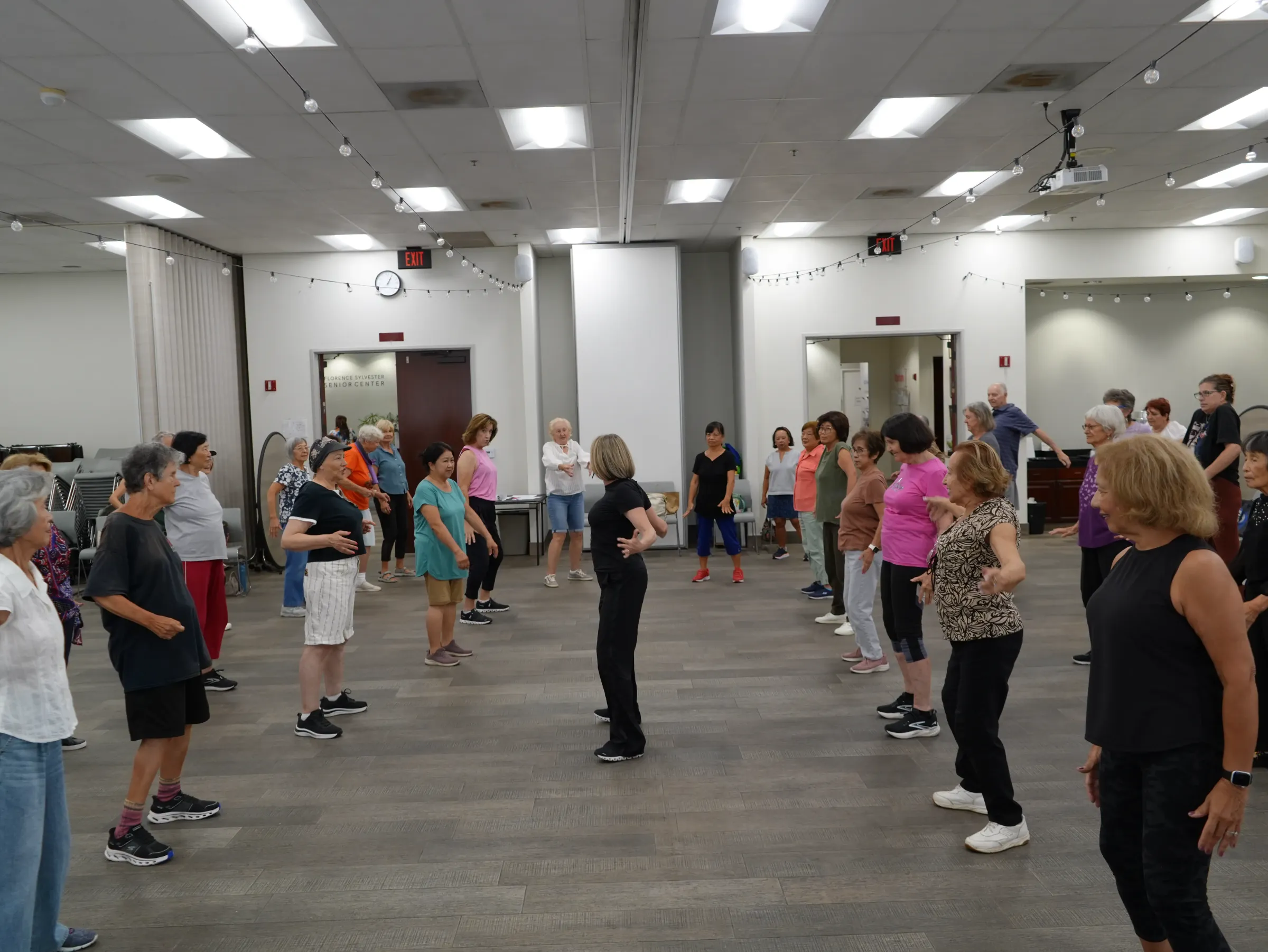 A Dance for Wellness class gathered at a senior center