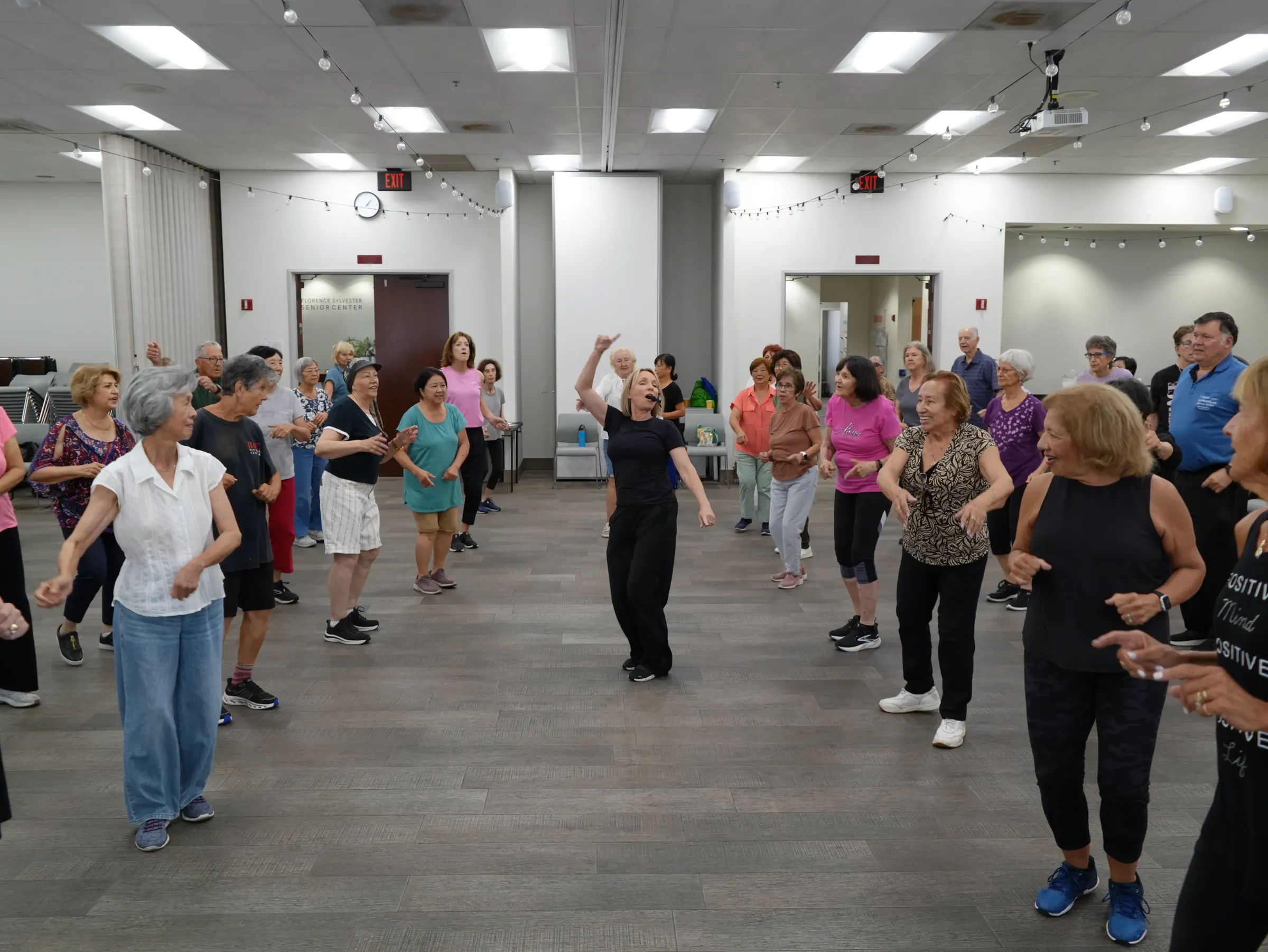 A Dance for Wellness class in full motion, led by an instructor